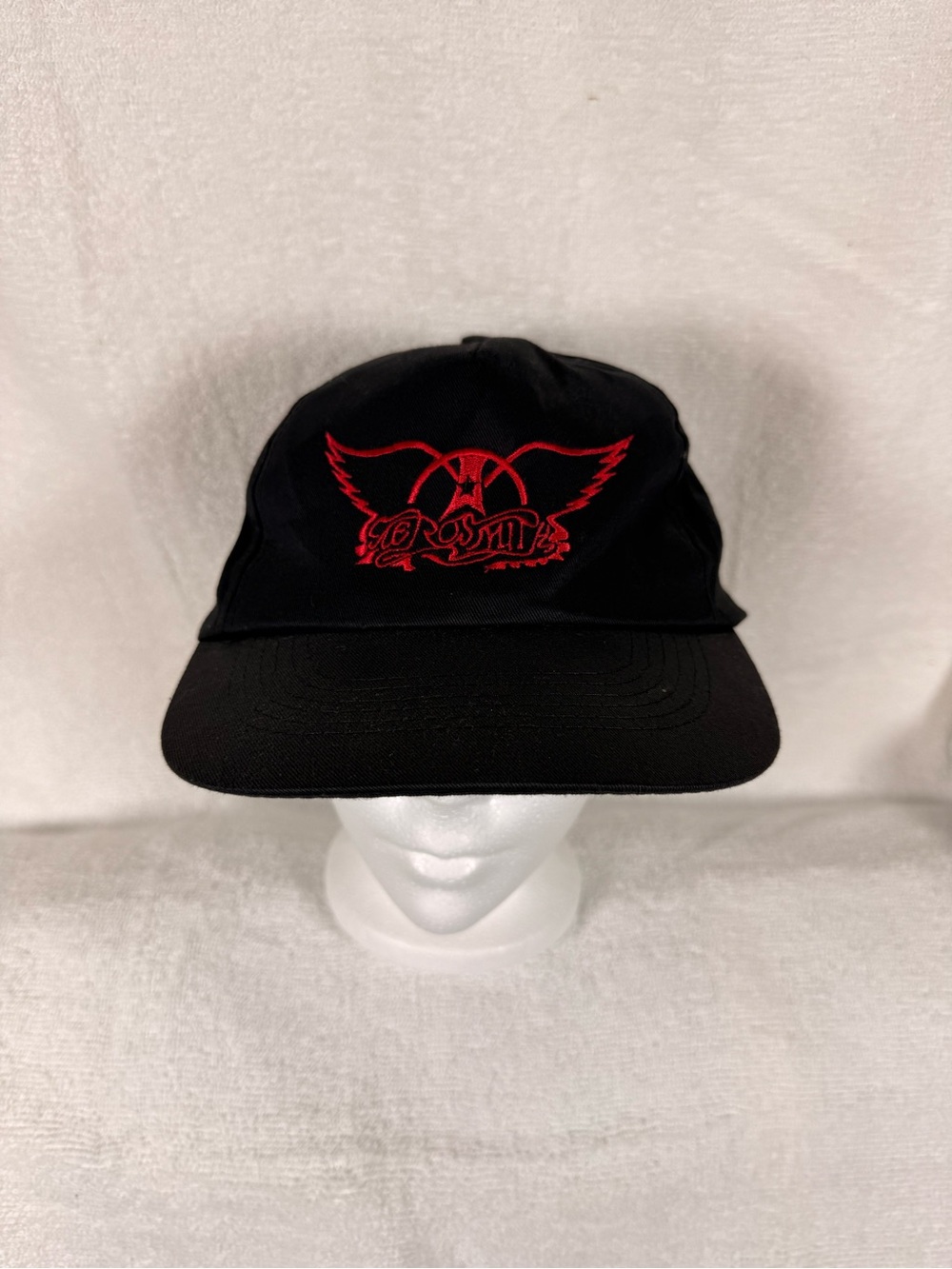 Aerosmith Black Snapback Hat with Red Wing Emblem